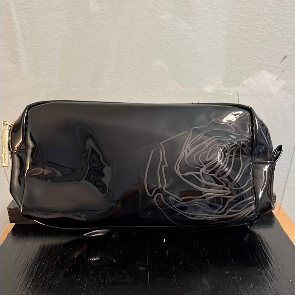 Free with purchase - 
Elegant Black cosmetic bag